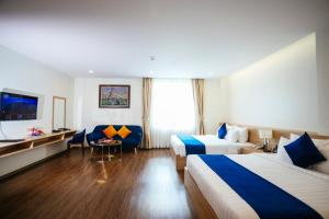 Postel nebo postele na pokoji v ubytování Sandals Star Hotel