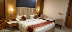 Katil atau katil-katil dalam bilik di Hotel Sakura by Maps