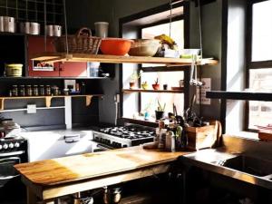 a kitchen with a stove and a counter top at African Soul Surfer in Muizenberg