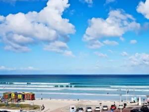 a view of the beach and the ocean at African Soul Surfer in Muizenberg