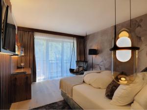 Postel nebo postele na pokoji v ubytování Boutique Hotel die Mittagspitze Superior