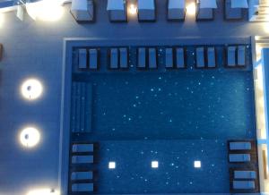 a view of a swimming pool at night at Manoula's Beach Mykonos Resort in Agios Ioannis Mykonos