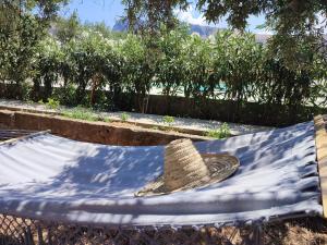 a straw hat sitting on top of a table at Inkantu B&B in Terrasini