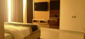 Katil atau katil-katil dalam bilik di Hotel Sakura by Maps