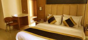 Katil atau katil-katil dalam bilik di Hotel Sakura by Maps
