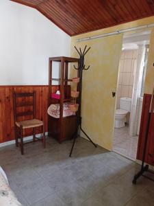 a room with a bathroom with a shower and a toilet at Petite Fleur de Lentilles 2 in Cilaos