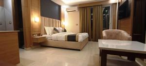 Katil atau katil-katil dalam bilik di Hotel Sakura by Maps