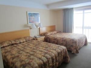 Ένα ή περισσότερα κρεβάτια σε δωμάτιο στο Star Lodge