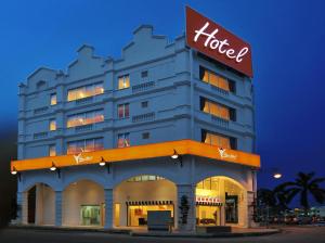 a hotel building with a sign on top of it at Your Hotel Klang by D'concept in Klang