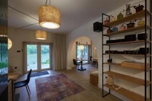 a living room with a table and a dining room at Zöld Béka Vendégház in Komló