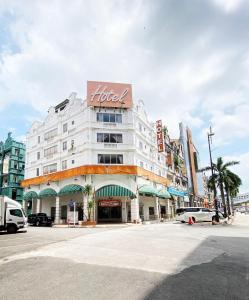 a building with a hotel sign on it on a street at Your Hotel Klang by D'concept in Klang