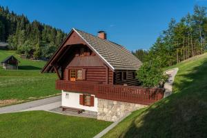 a small house on top of a hill at Chalet Ajda in Bohinj