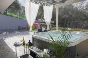 The swimming pool at or close to Diamond Luxury Villa Corfu
