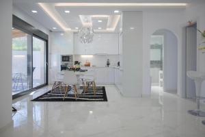 A kitchen or kitchenette at Diamond Luxury Villa Corfu