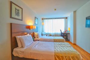 Ένα ή περισσότερα κρεβάτια σε δωμάτιο στο Hotel Clarks Collection Vadodara +78 φωτογραφίες