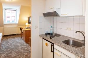 Kuchyň nebo kuchyňský kout v ubytování Maximilian Hotel & Apartments Weil am Rhein / Basel