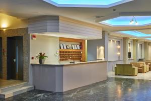 a lobby with a bar in a building at Byzantio Hotel in Ioannina