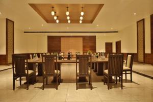 a large dining room with a large table and chairs at Mannat Resort Paota in Prāgpura +50 photos