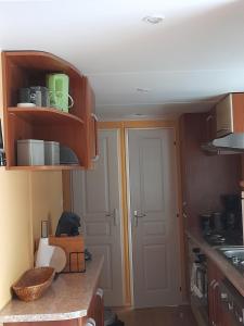 Kuchyň nebo kuchyňský kout v ubytování Mobil home camping