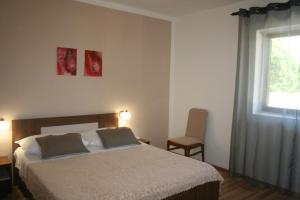 Postel nebo postele na pokoji v ubytování Apartment Privlaka 12957a