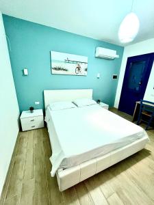 Postel nebo postele na pokoji v ubytování B&B Santorini