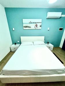 Postel nebo postele na pokoji v ubytování B&B Santorini