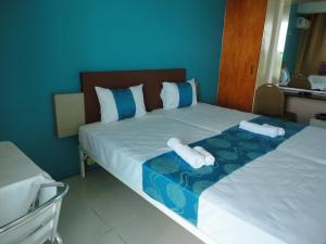 Postel nebo postele na pokoji v ubytování Hypertek Guesthouse