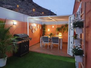 Fotografia z galérie ubytovania Fantástico ático con Jacuzzi y preciosa terraza v destinácii Puerto Rico de Gran Canaria