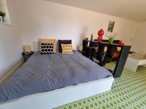 a bedroom with a large bed in a room at La Fruitière in Chaudenay