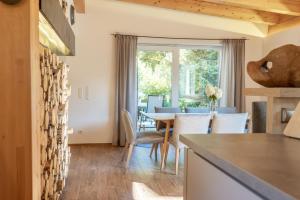 a kitchen and dining room with a table and chairs at Haus Trudi in Walchsee