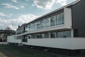 an external view of a building with glass windows at Roannay - Francorchamps in Francorchamps