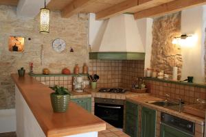 A kitchen or kitchenette at Family friendly house with a swimming pool Mrkoci, Central Istria - Sredisnja Istra - 13003