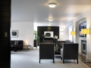 a lobby with two chairs and a living room at The Croke Park Hotel in Dublin