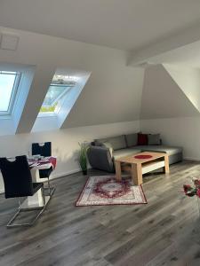 a living room with a couch and a table at Sorinas Home WB16 Top 15 in Wagersbach