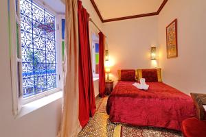 Postel nebo postele na pokoji v ubytování Riad Hôtel Essaouira