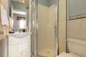 a bathroom with a shower and a toilet and a sink at Apartments by the sea Sumartin, Brac - 2940 in Sumartin +11 photos