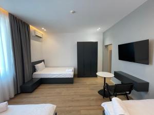 Postel nebo postele na pokoji v ubytování Ladi Rooms
