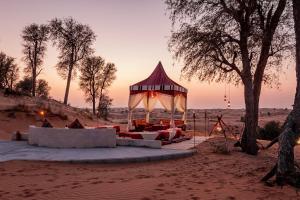 a gazebo in the middle of the desert at Bedouin Oasis Desert Camp- Ras Al Khaimah in Ras al Khaimah
