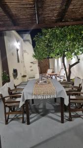 a table and chairs with a blanket on top of it at Cretan House Antonis in Kamilari