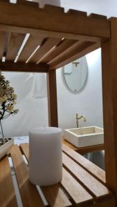 a bathroom with a sink and a counter with a white sink at Cretan House Antonis in Kamilari