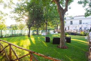 a garden with trees and a fence at DONNA ROSITA in San Felice a Cancello