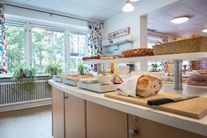 a bakery with a loaf of bread on a counter at Miatorp Hotell in Helsingborg