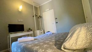 Postel nebo postele na pokoji v ubytování B&B Aurora
