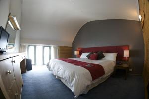 Ένα ή περισσότερα κρεβάτια σε δωμάτιο στο The Perisher Valley Hotel