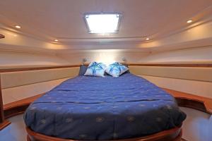 a bed in the middle of a boat at Private yacht, we love our guests in Lisbon