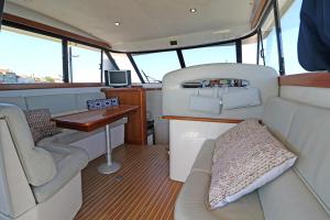 a view of the inside of a boat with a table at Private yacht, we love our guests in Lisbon