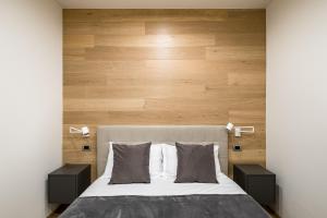 A bed or beds in a room at Fragole Suite
