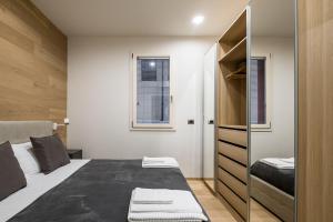 A bed or beds in a room at Fragole Suite