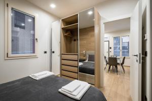 A bed or beds in a room at Fragole Suite