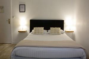 Postel nebo postele na pokoji v ubytování Hotel Joly